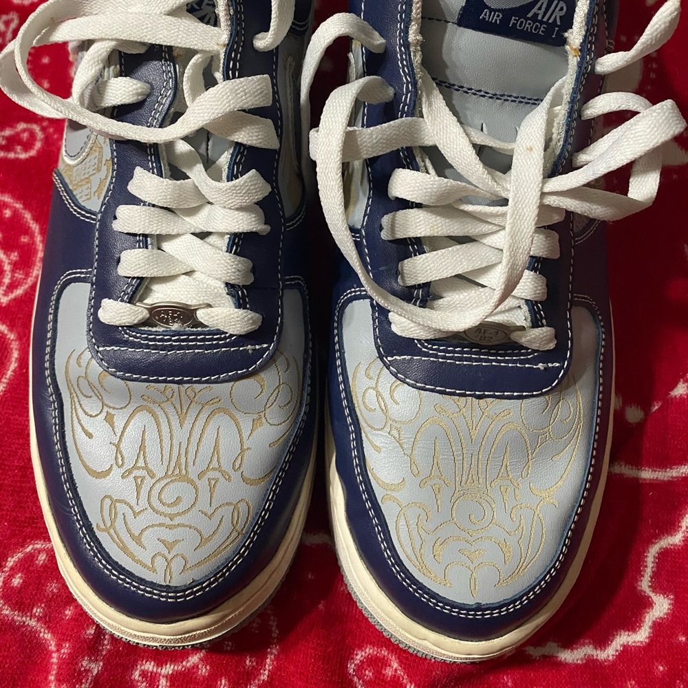 Blue and white Nike tennis shoes